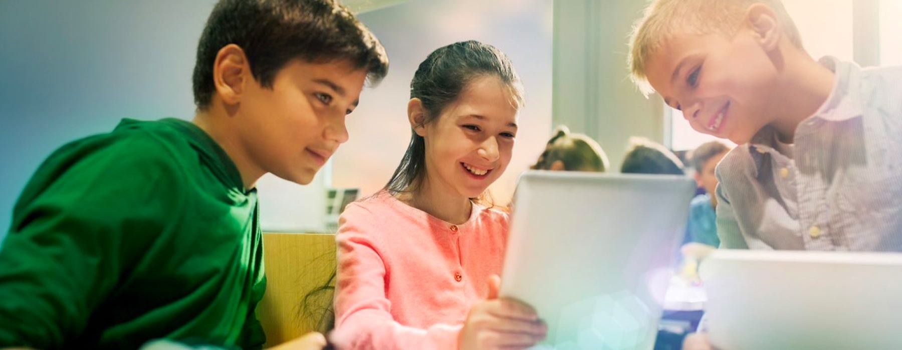 kids looking at tablet