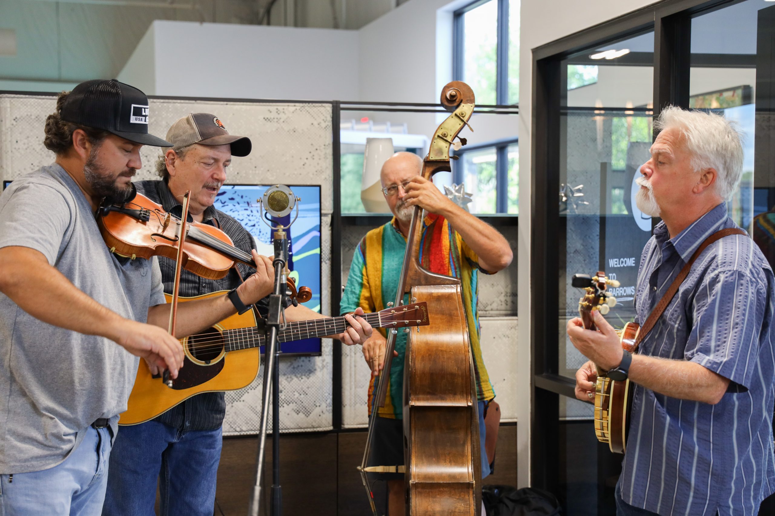 group of men playing stringed instruments